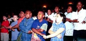 Children at a Library of Congress lifelong readers event sing We Shall Overcome.