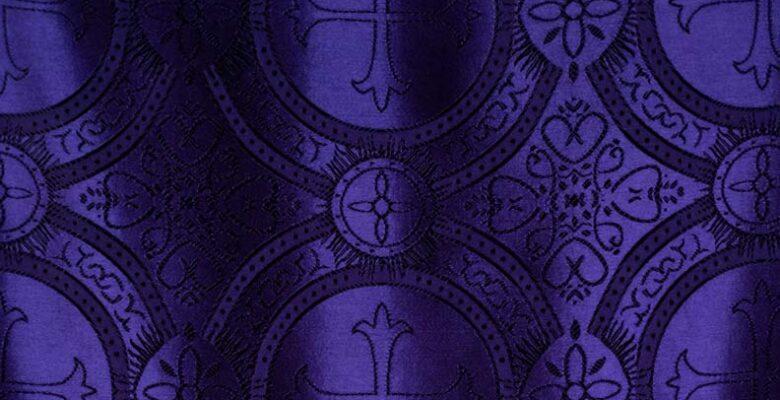 Dark purple patterned clothe with crosses.