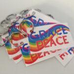 Cards with rainbow flag and words Grace + Peace