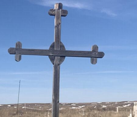 Wooden cross agains blue sky.