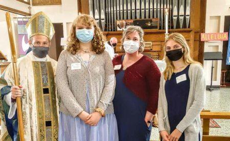A bishop and three women, all masked.