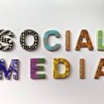 The phrase "social media" spelled in multi-colored letters.
