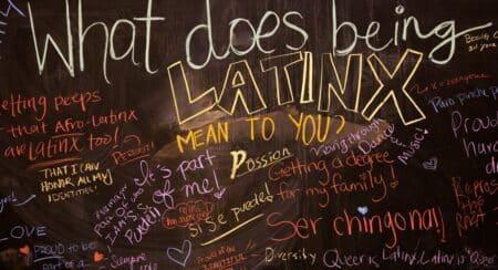 Question "What does being Latinx mean to you?" with words in response on dark gray background
