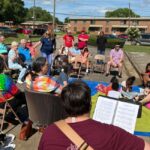 The Abbey community in Alabama worshipping outside in their neighborhood