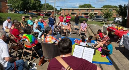 The Abbey community in Alabama worshipping outside in their neighborhood