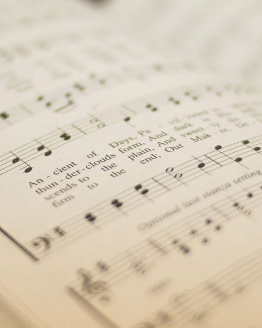Close-up of a page printed with the music of the hymn "O Worship the King"